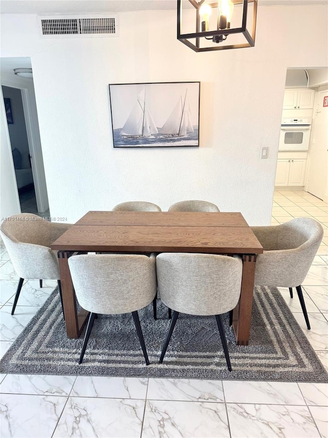 dining room with an inviting chandelier