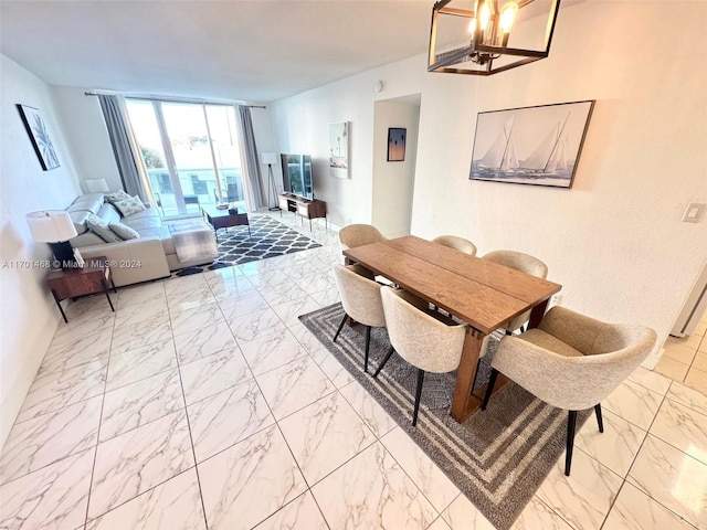 dining area featuring an inviting chandelier