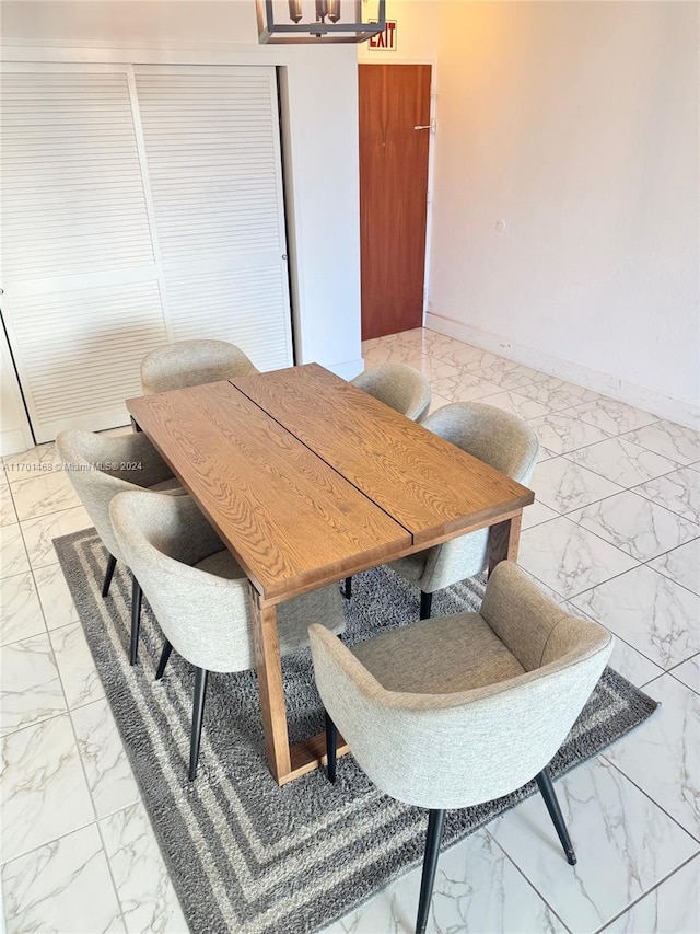 dining space with a chandelier