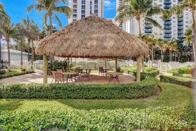 view of property's community with a gazebo and a patio area