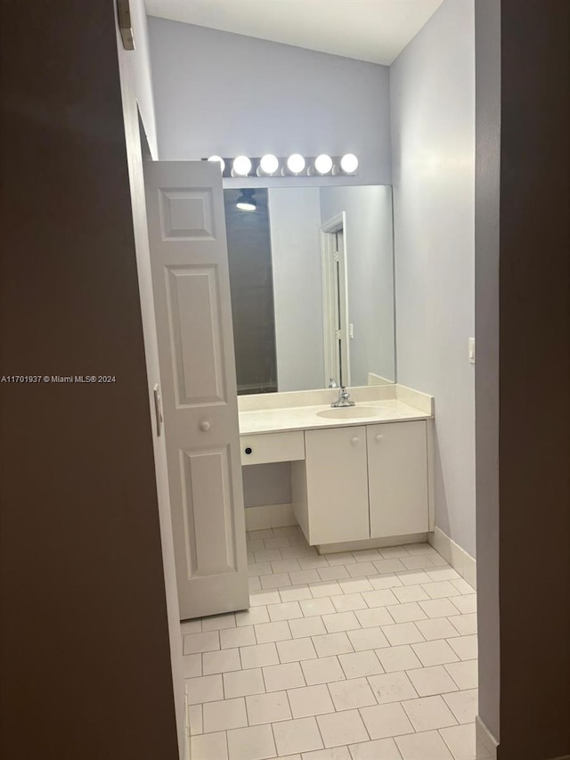 bathroom featuring tile patterned floors and vanity