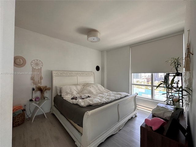 bedroom with hardwood / wood-style floors