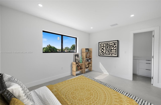 bedroom with concrete flooring