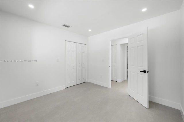 unfurnished bedroom featuring a closet