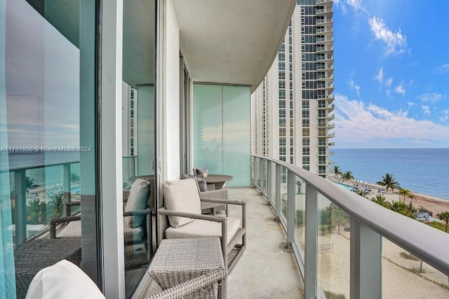 balcony featuring a water view