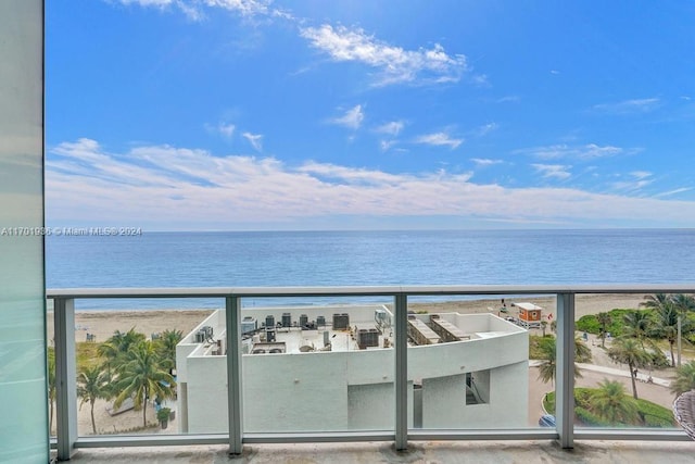 balcony with a view of the beach and a water view