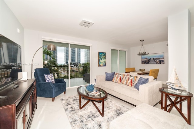 living room featuring a notable chandelier