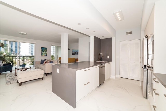 17145 N Bay Rd Unit 4607, Sunny Isles Beach, FL 33160 - kitchen featuring modern cabinets, light marble finish floors, dishwasher, white cabinets, and open floor plan