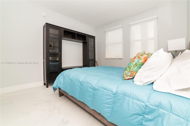 17145 N Bay Rd Unit 4607, Sunny Isles Beach, FL 33160 - bedroom featuring light marble finish floors and baseboards