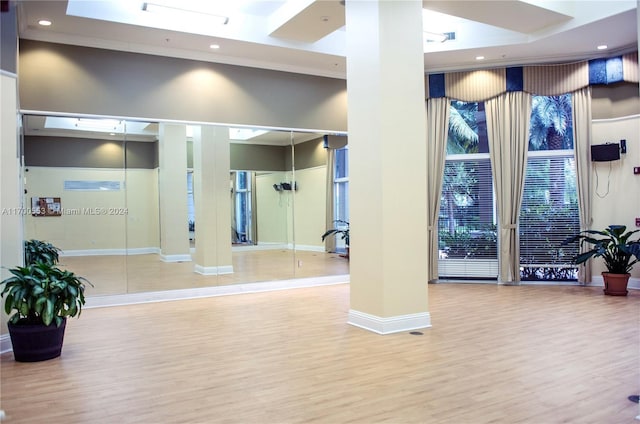 17145 N Bay Rd Unit 4607, Sunny Isles Beach, FL 33160 - workout area with wood finished floors, decorative columns, and recessed lighting
