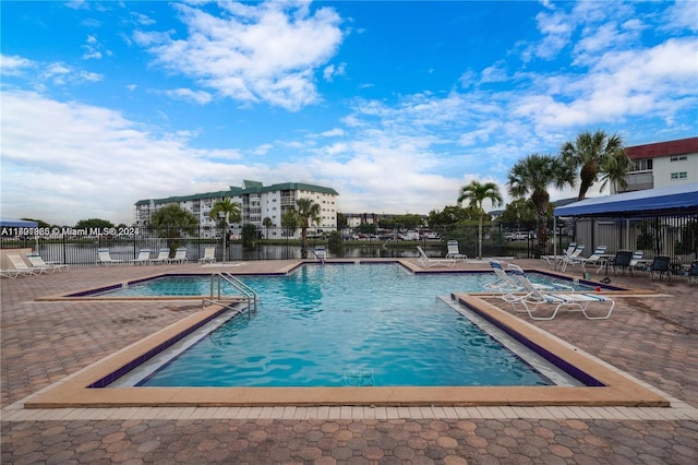 view of swimming pool featuring a patio