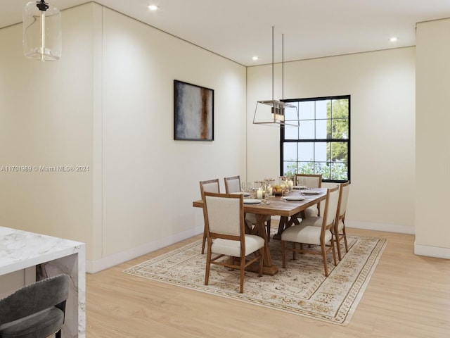 dining space with light hardwood / wood-style floors