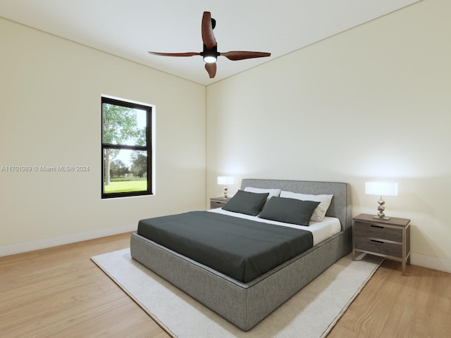 bedroom with hardwood / wood-style floors and ceiling fan