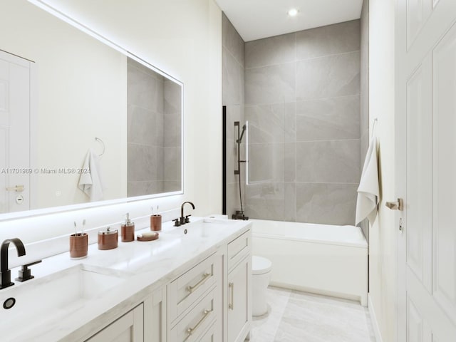 full bathroom featuring vanity, toilet, and tiled shower / bath