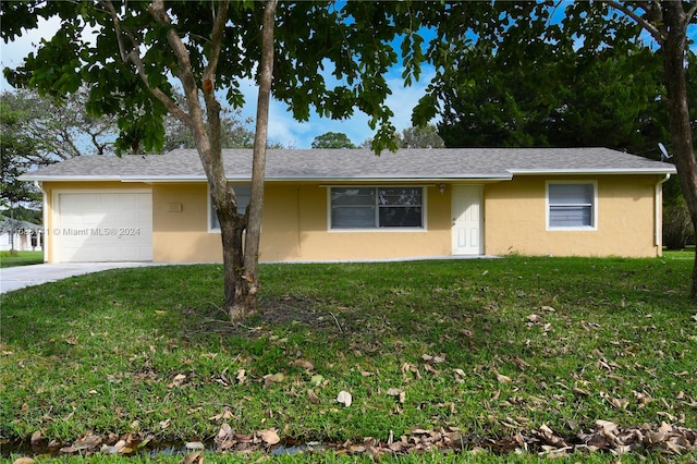 single story home with a front lawn and a garage