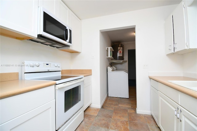 kitchen featuring electric stove, washer / clothes dryer, sink, and white cabinets