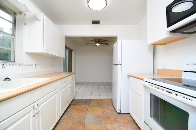 kitchen featuring white cabinetry, sink, ceiling fan, and white appliances