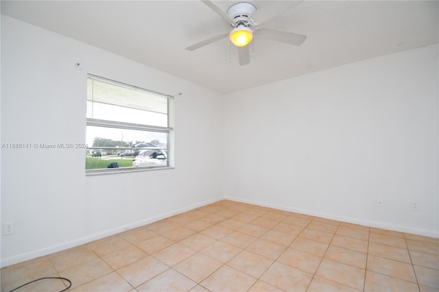 tiled empty room with ceiling fan