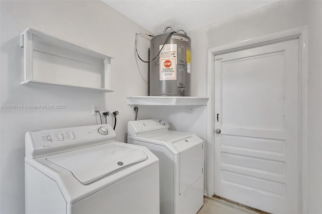 1101 SW Addie St, Port St Lucie, FL 34983 - washroom featuring electric water heater and washing machine and clothes dryer
