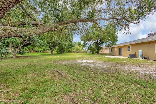 1101 SW Addie St, Port St Lucie, FL 34983 - view of grassy yard featuring a patio