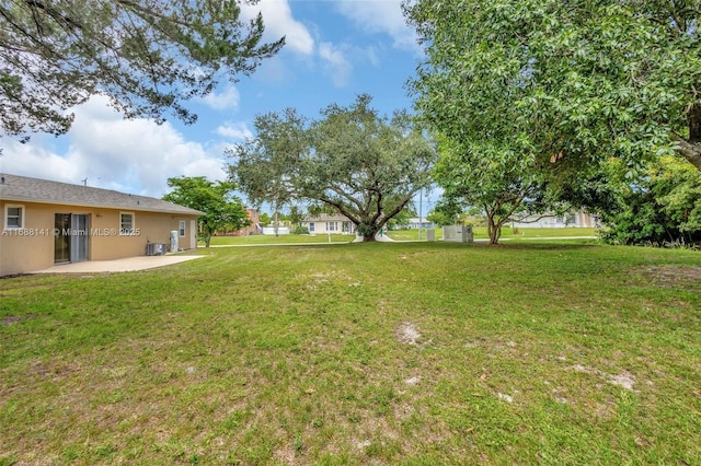 1101 SW Addie St, Port St Lucie, FL 34983 - view of grassy yard with a patio area
