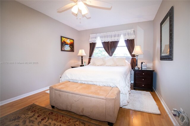 bedroom featuring light hardwood / wood-style flooring and ceiling fan