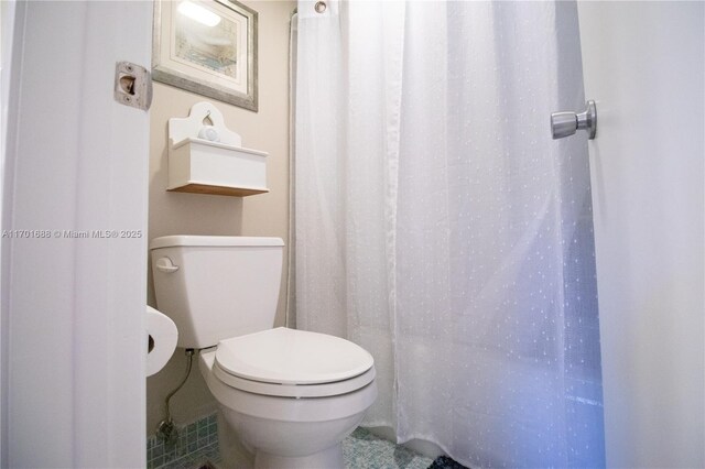 bathroom featuring tile patterned floors and toilet