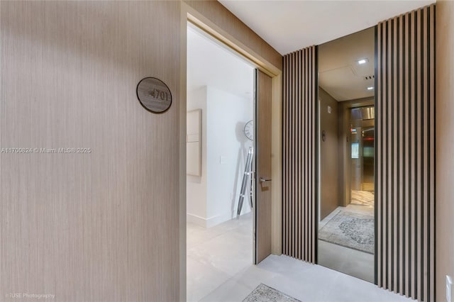 hallway with light tile patterned floors