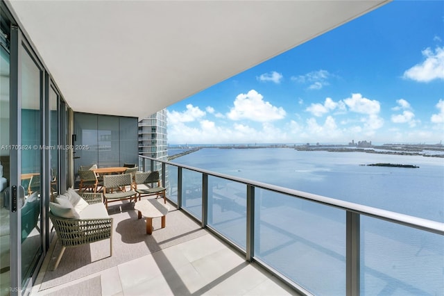 balcony featuring a water view