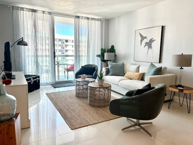 living room with light tile patterned floors and a textured ceiling