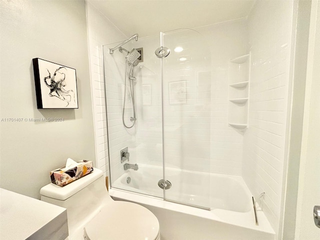 full bathroom featuring vanity, toilet, and tiled shower / bath