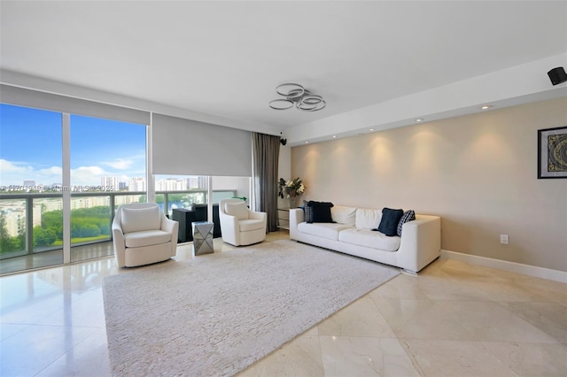 living room featuring floor to ceiling windows