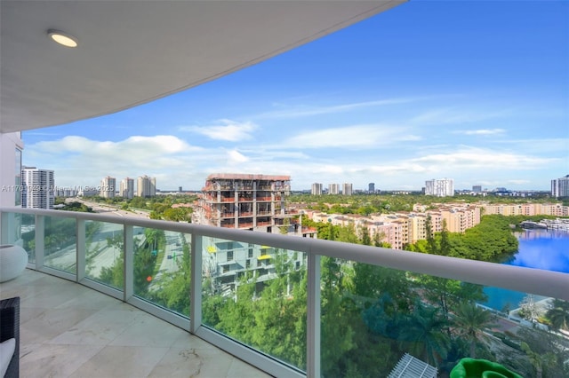 balcony featuring a water view