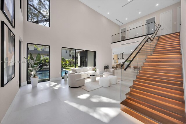 living room with a high ceiling and french doors