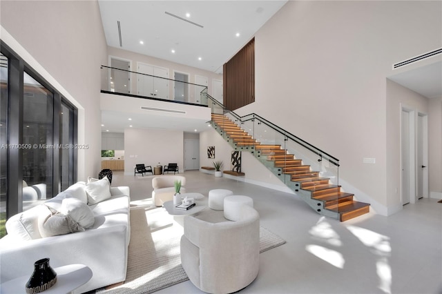 living room with a towering ceiling