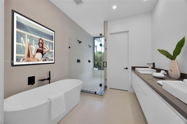 bathroom featuring vanity and separate shower and tub