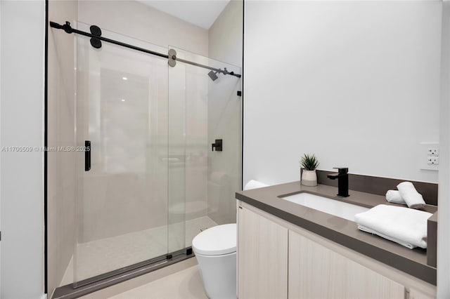 bathroom with a shower with door, vanity, and toilet