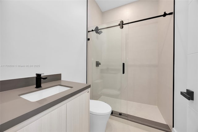 bathroom with vanity, toilet, and an enclosed shower