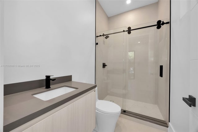 bathroom featuring vanity, toilet, and walk in shower