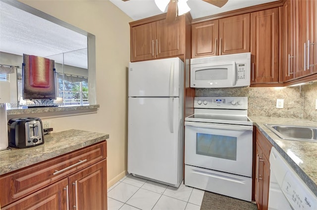 kitchen with ceiling fan, sink, tasteful backsplash, white appliances, and light tile patterned floors