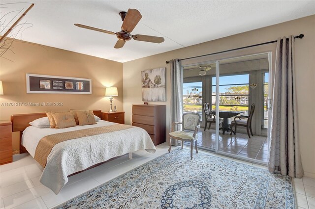 tiled bedroom featuring access to exterior and ceiling fan