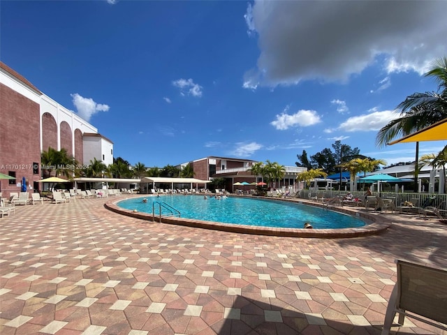 view of swimming pool with a patio area