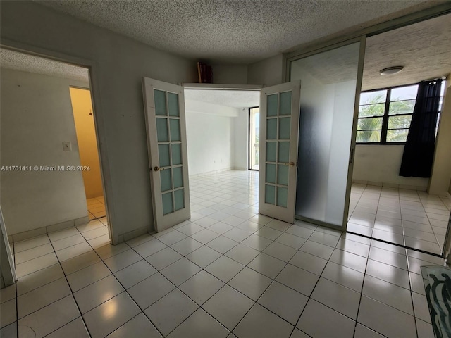 spacious closet with light tile patterned floors