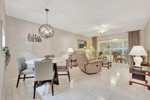 tiled dining area with ceiling fan with notable chandelier