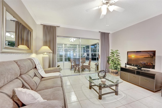 living room featuring light tile patterned floors, a textured ceiling, ceiling fan, and crown molding