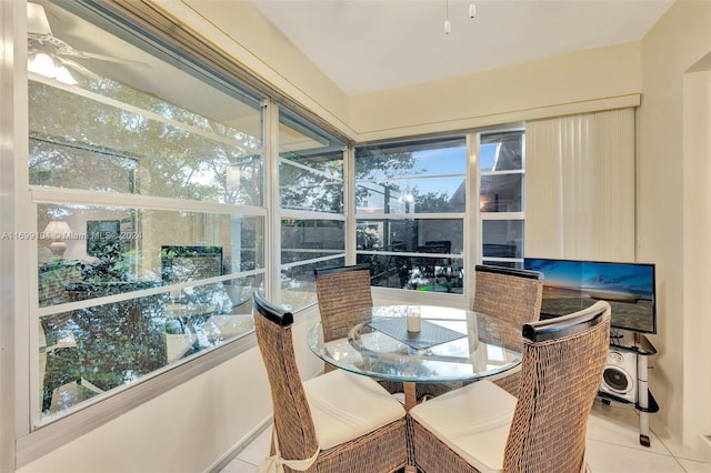 sunroom with a wealth of natural light and ceiling fan