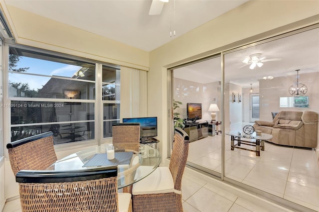 sunroom featuring ceiling fan