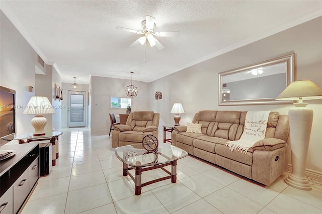 tiled living room with a textured ceiling, ceiling fan with notable chandelier, and crown molding