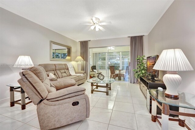 living room with ceiling fan, light tile patterned floors, and ornamental molding