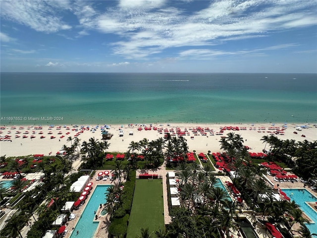 drone / aerial view with a water view and a view of the beach